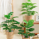 Artificial monstera and palm leaves for decoration