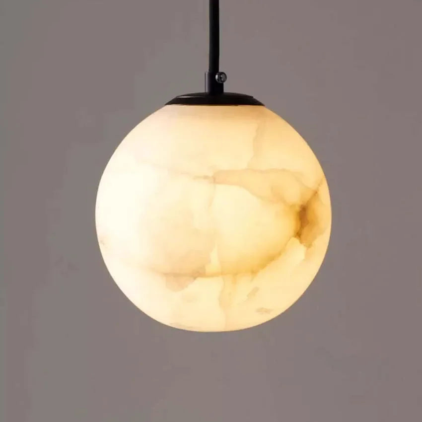 Nordic marble pendant light with elegant suspended globe