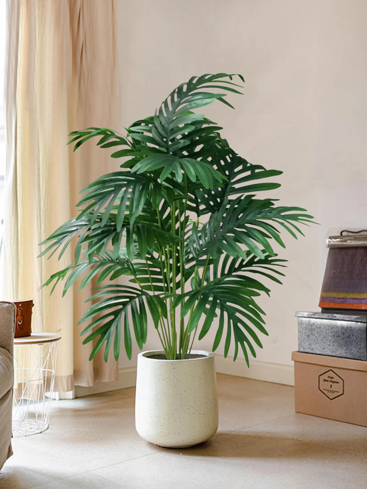 Artificial palm tree with tropical leaves for interior decoration