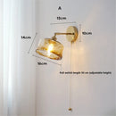 Retro rotating wall light in glass and copper with switch