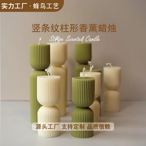 handcrafted scented candles with striped columns and wind chimes