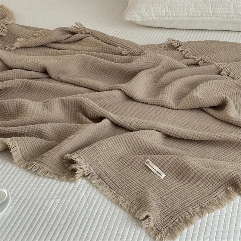 Soft cotton throw with pom-poms, plain style for living room