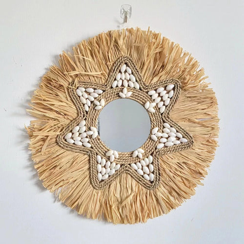 decorative mirror made of raffia and shells for wall decoration