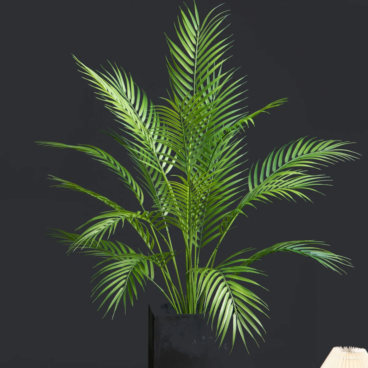 Large artificial palm tree with monstera leaves for outdoor decoration