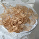 Set of artificial ginkgo, eucalyptus and holly leaves for floral decoration