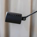 Minimalist LED floor lamp with long metal arm and adapted plug