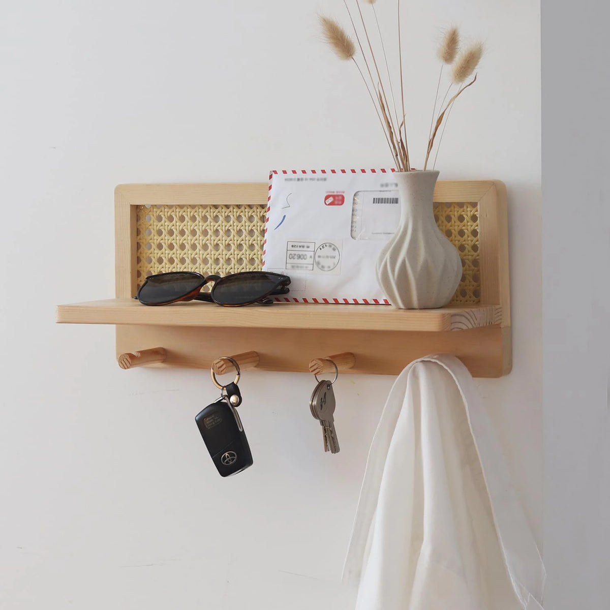 rattan wall rack for keys, books and magazines