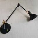 Vintage black and gold metal wall light for elegant interiors