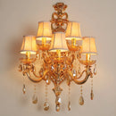 Elegant gold crystal wall light with five heads for stylish interiors