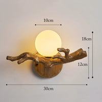 Vintage LED wall light in resin tree branch design