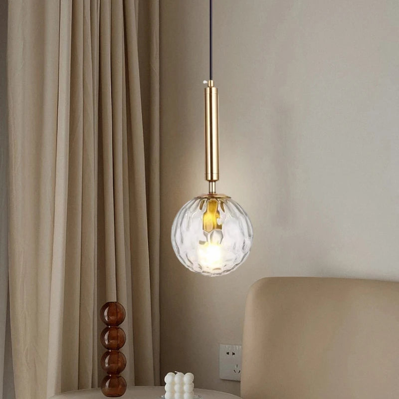 Modern glass pendant light with adjustable gold metal bulb