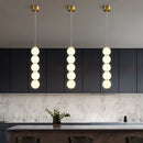 Designer LED pendant light with glossy gold glass ball