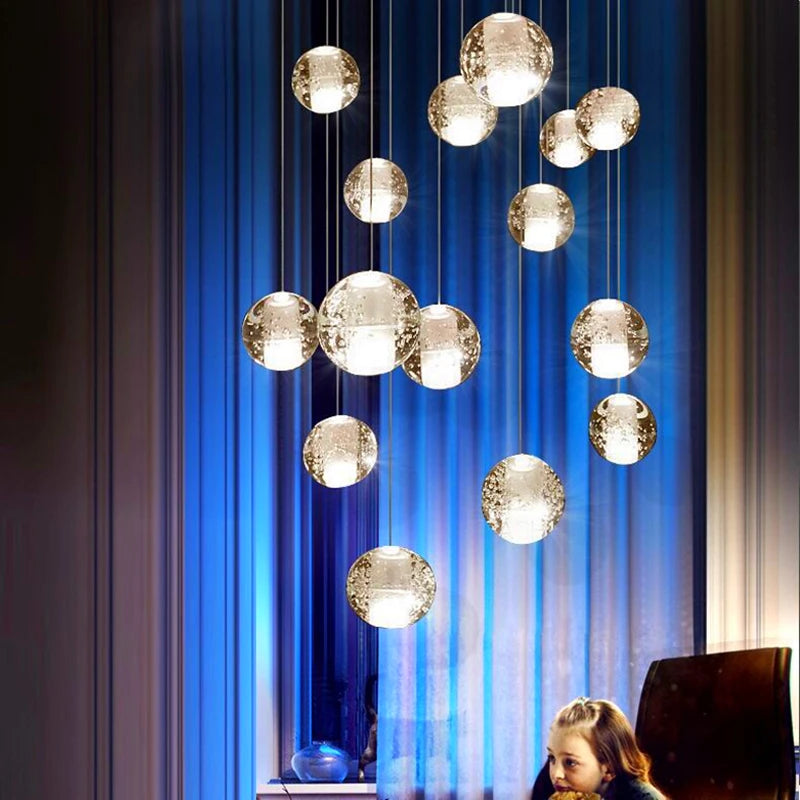 Modern crystal chandelier with rotating LED ball pendant