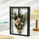 Handmade wooden photo frame with dried flowers and 3D plants