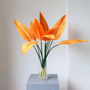 Tropical floral arrangement with decorative birds and bananas for weddings