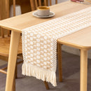 Boho beige table runner with geometric patterns and tassels