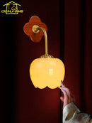Traditional copper and wood wall light with jade lampshade