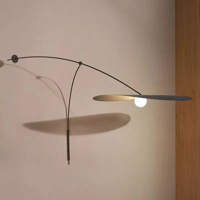 Minimalist long arm rotating reading wall light