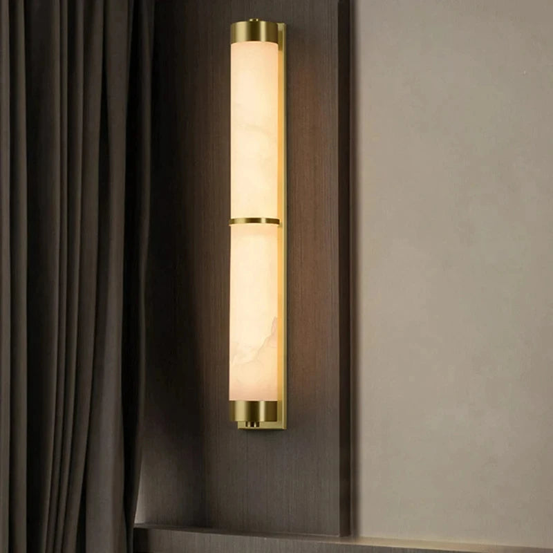 Cylindrical natural marble and gold brass wall light for hotels