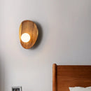 Natural wood wall light with vintage glass shade