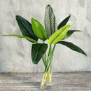 Tropical floral arrangement with decorative birds and bananas for weddings