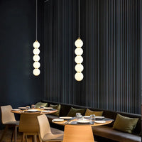 Designer LED pendant light with glossy gold glass ball