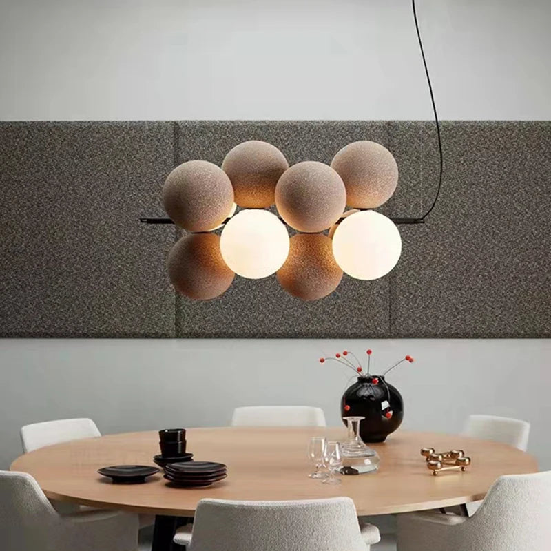 Modern pendant light with adjustable cord and glass bulb