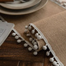 Beige country-style table runner with tassels