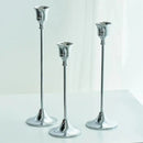 Set of three gold brass candle holders for weddings and dinners