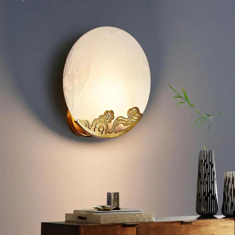 Copper wall light with marble shade and luxury mirror