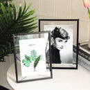 Floating glass photo frame with decorative pressed flowers