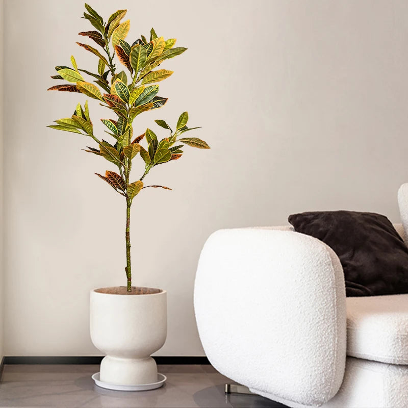 Large artificial tropical plants ficus and codiaeum for indoor decor