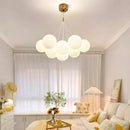 Modern glass chandelier with white LED spheres for living and dining room