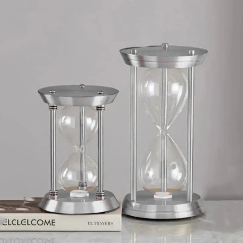 empty decorative metal hourglass bottle with colored sand