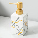 ceramic soap dispenser with gold pump for bathroom