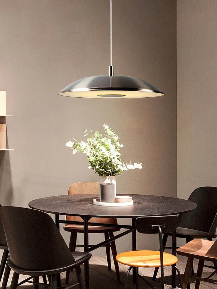 Minimalist circular pendant light with flying saucer design