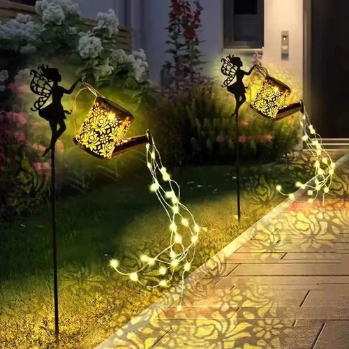 Solar watering can with garden lights and fairy statues