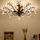 Vintage black metal chandelier with crystal pendants for modern interiors