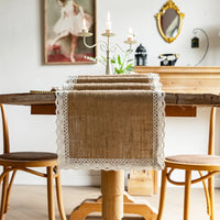 Beige jute-effect table runner with tassels, rustic style