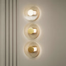 Elliptical glass and gold metal wall light