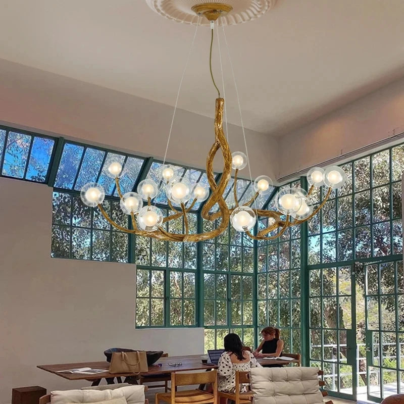 Designer branch-effect resin chandelier with glass ball