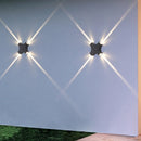 Narrow LED wall light with four beams for outdoor garden lighting