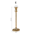 Set of three gold brass candle holders for weddings and dinners
