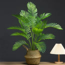 Large artificial plants palm, monstera and fern garden decoration