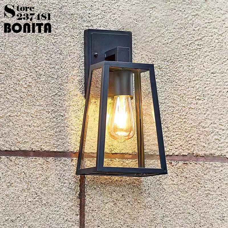 Vintage industrial wall light in iron and clear glass