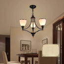 Vintage iron and bronze chandelier with glass shade, loft style