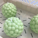 silicone candle mold in the shape of a cylindrical ball and bubble