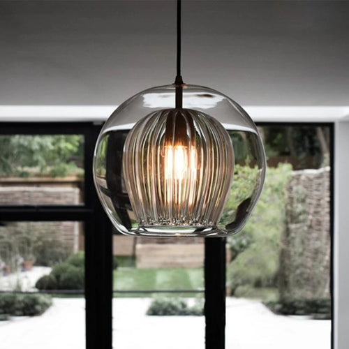 Round glass pendant light with elegant industrial style