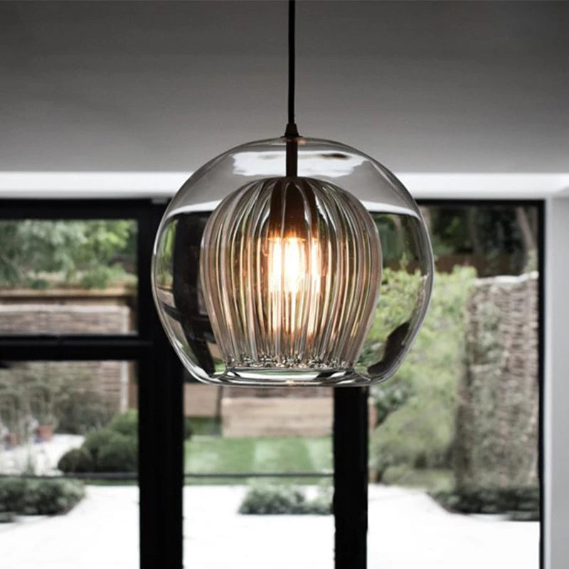 Round glass pendant light with elegant industrial style