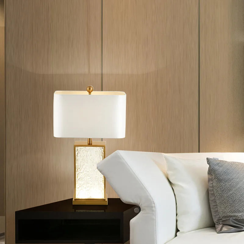 Modern glass table lamp with decorative gold frame
